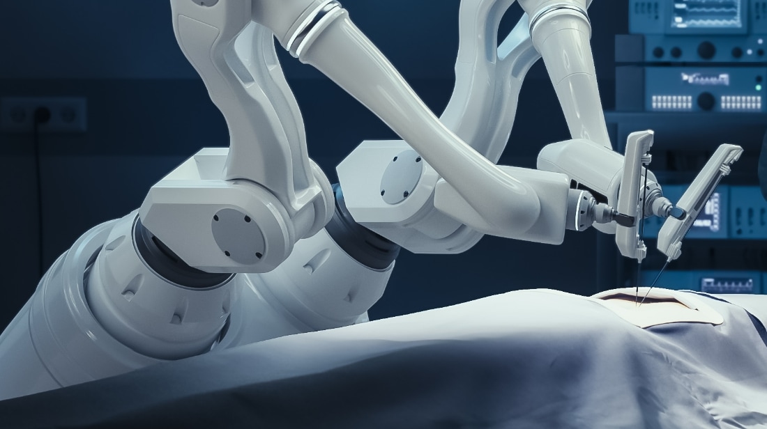robotic arm operating room A robotic arm with surgical instruments poised over a patient lying on an operating table, in a sterile medical environment.
